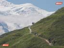 Mountain Bikers riding a singletrack climb with Mont Blanc View